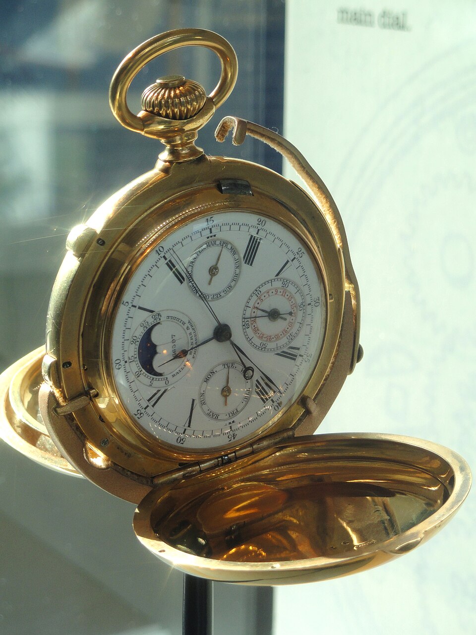 Macro view of chronograph pushers and subdials showing dual seconds hands