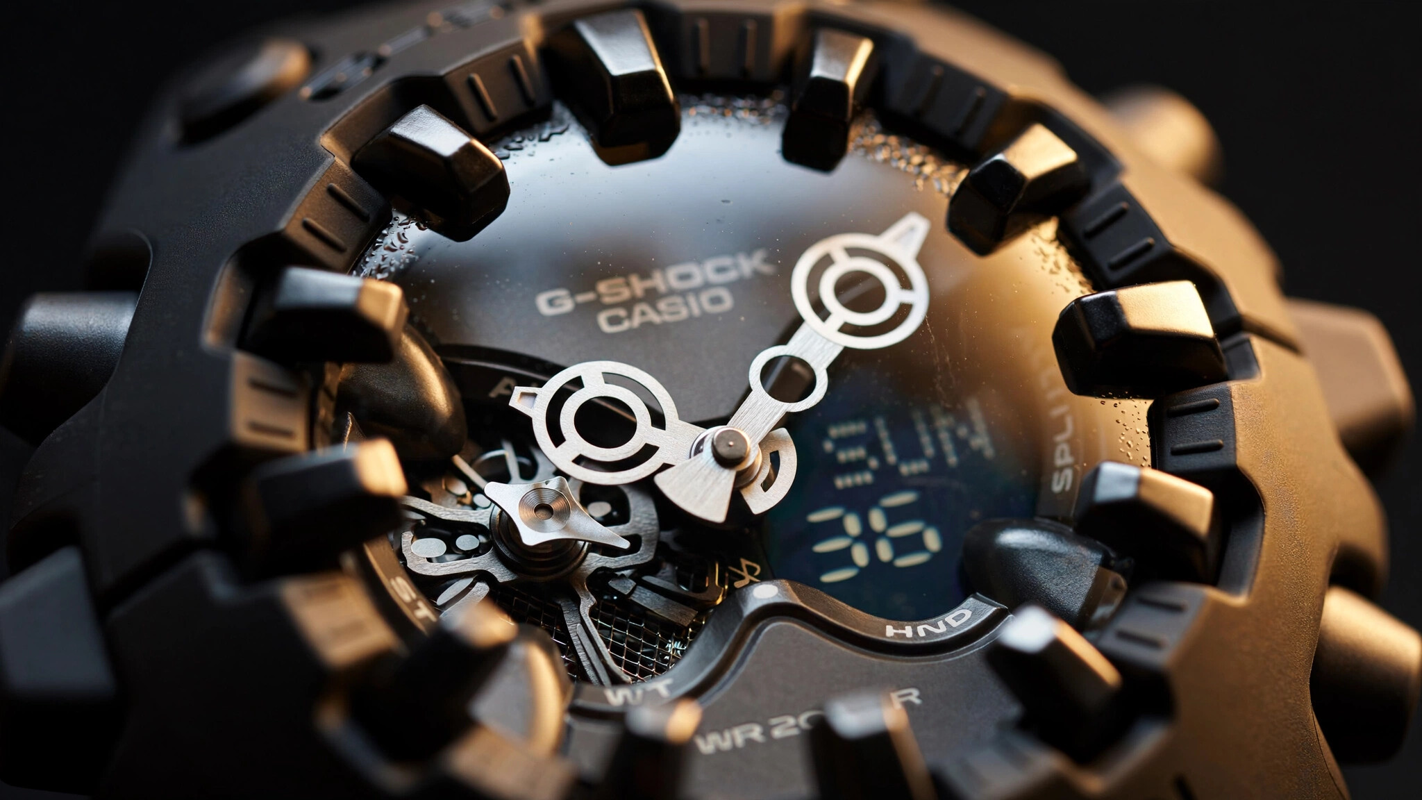 Macro photograph of a G-Shock GA-V01 watch face with its oversized minute hand and spherical crystal