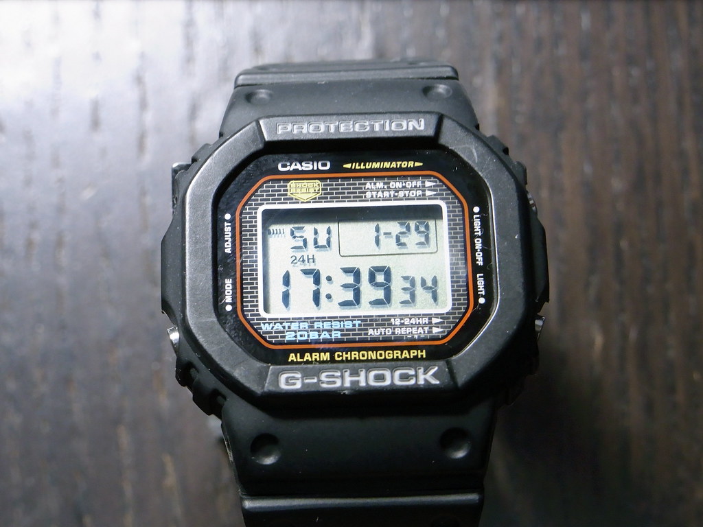 G-Shock full-metal square with iridescent rainbow finish catching light