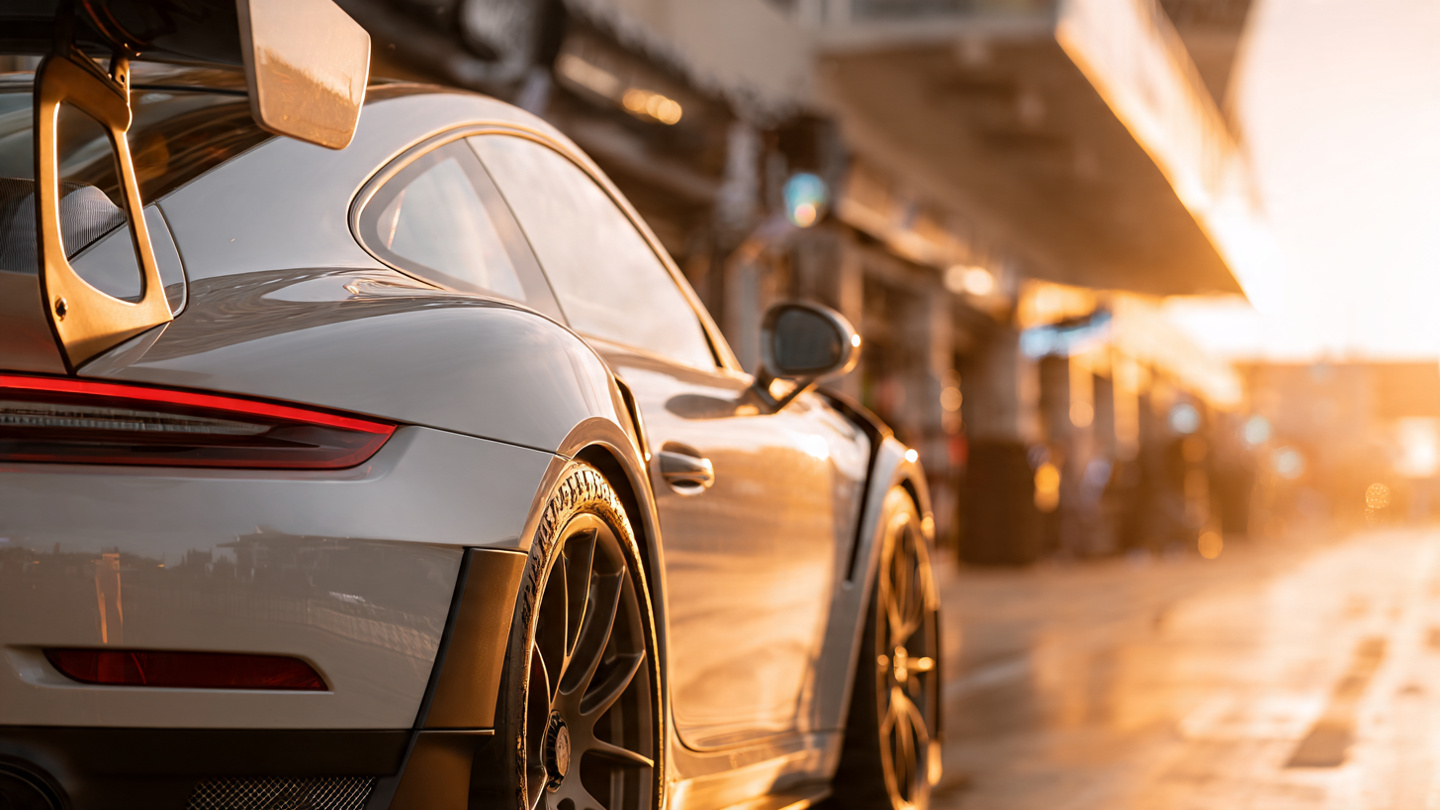 Porsche 911 GT2 RS with Manthey Performance Kit showing carbon fiber aerodynamic elements, magnesium wheels, and rear aerodisc detail